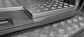 A close-up of the plywood and aluminium floor liner 